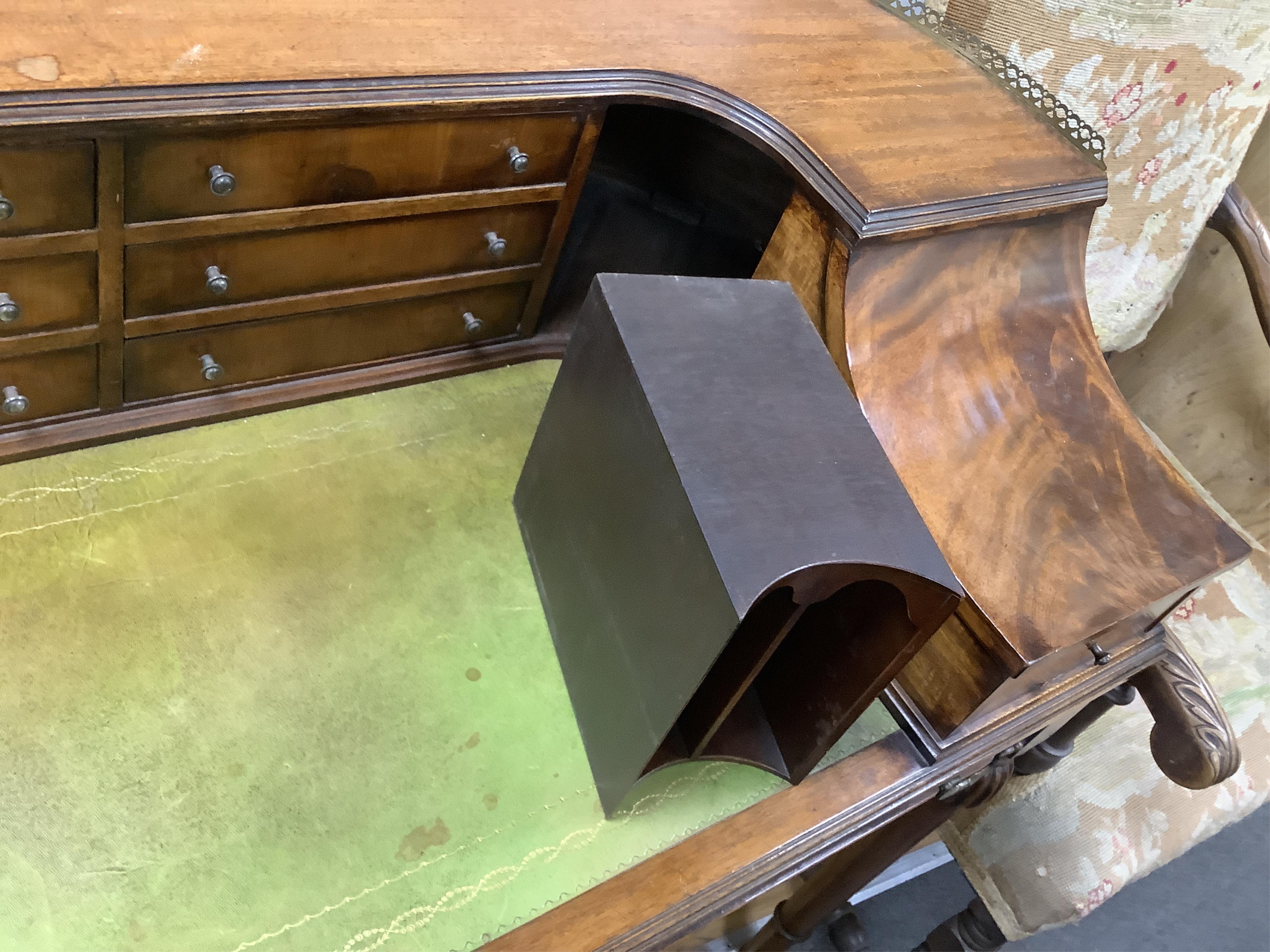 A reproduction mahogany Carlton House style desk, width 122cm, depth 62cm, height 98cm. Condition - fair to good